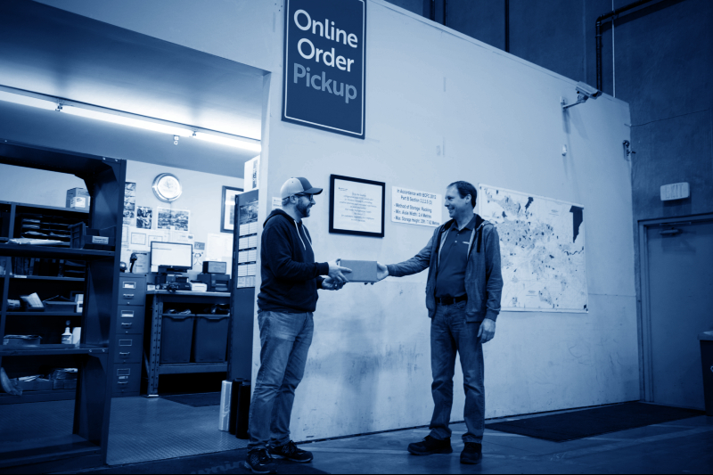 RSL online order pickup area with customer and employee